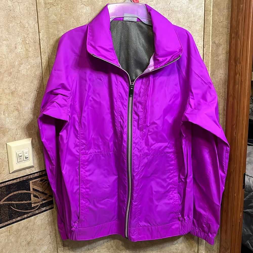 Columbia rain jacket without hood. New without tags. Smoke free pet free home.